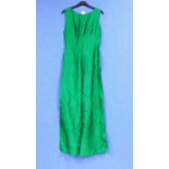 A ladies custom made sleeveless evening gown, in emerald green shot satin, sleeveless with low
