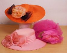 Three occasion wear hats, to include an Italian pink straw and net hat by Marzi, an orange and