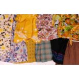 A quantity of mid 20th Century ladies skirts and tops, (10)