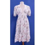 A 1960's Ossie Clarke for Radley floral print dress, the cream dress with red, blue, green and black