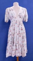 A 1960's Ossie Clarke for Radley floral print dress, the cream dress with red, blue, green and black