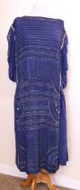 An Edwardian beaded dress, the blue chiffon dress with allover beaded detail, sleeveless