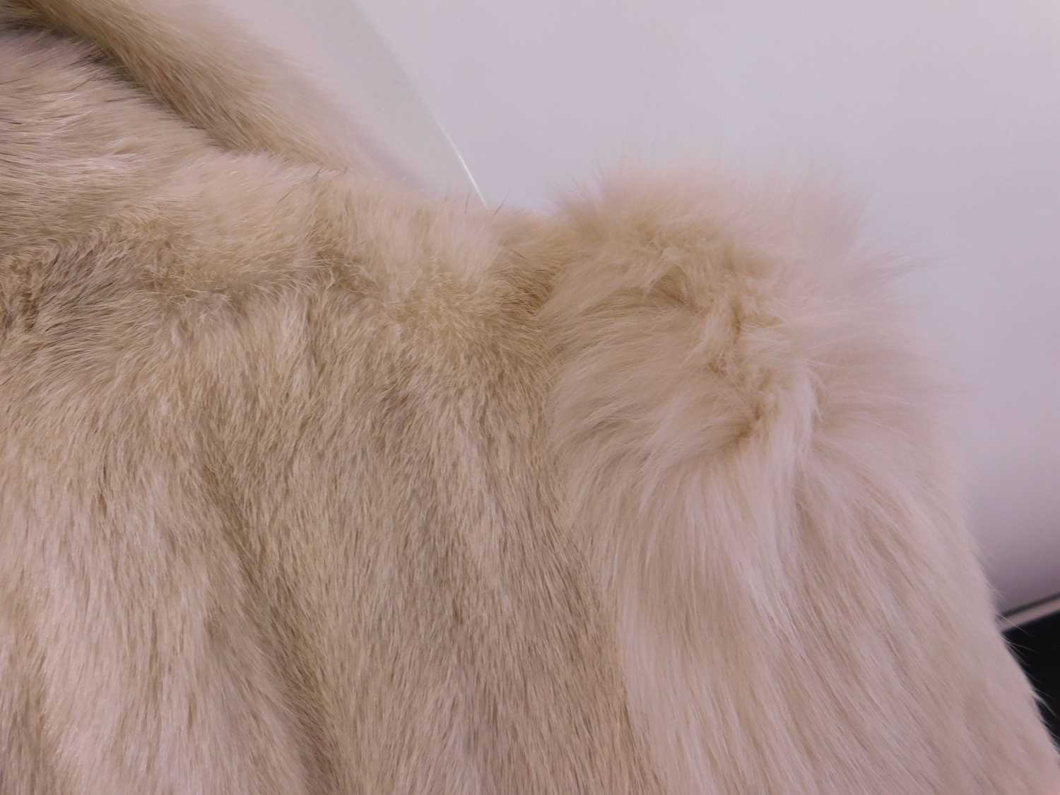 A lady's full length cream fur coat by Hurtiq Ltd overall good with no obvious signs of wear or - Image 10 of 14
