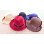 A quantity of lady's hats to include a brown felt hat by Kangol, three others similar by various