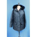 A lady's black Belstaff hooded parka, zip fronted with storm flap and popper fastening, front