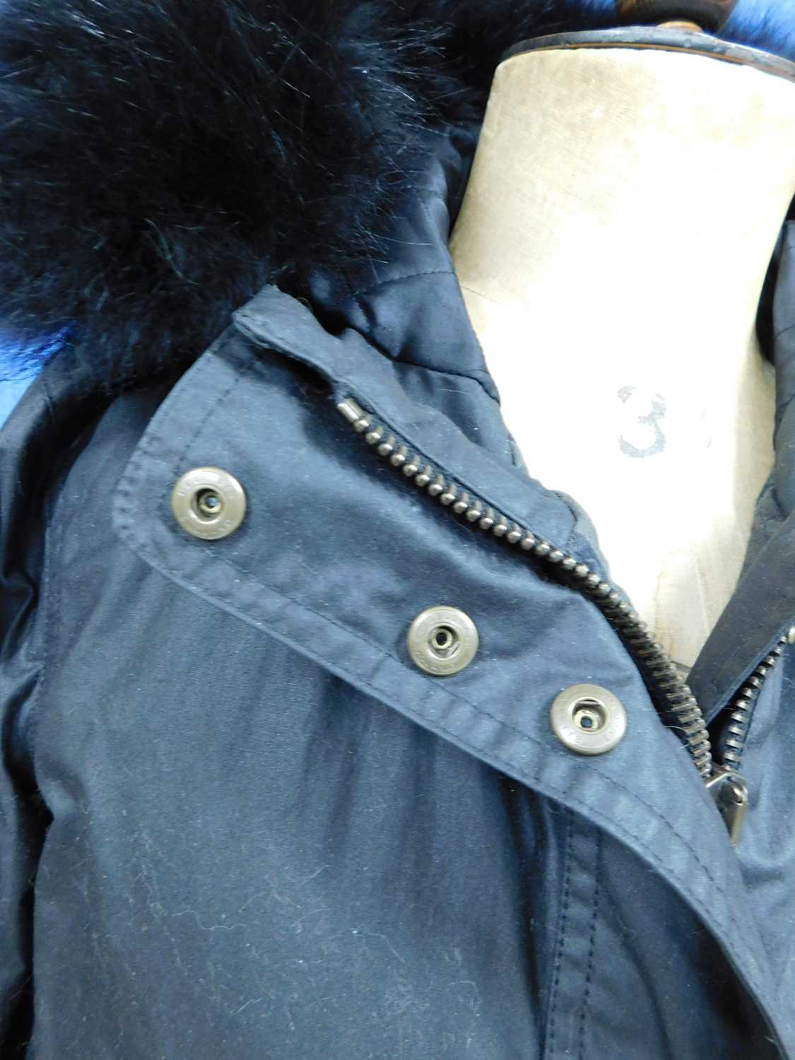 A lady's black Belstaff hooded parka, zip fronted with storm flap and popper fastening, front - Image 7 of 9