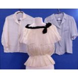 Three mid 20th century lady's blouses, to include a cream silk blouse, a pale blue silk blouse
