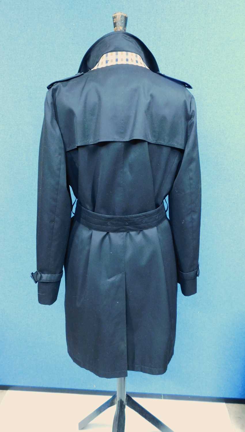 A lady's black Aquascutum trenchcoat, the double breasted coat with belted/tie waist, custom - Image 2 of 5