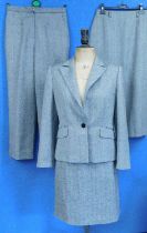 A lady's suit by Artigiano; the herring bone wool suit comprising of single breasted jacket, knee