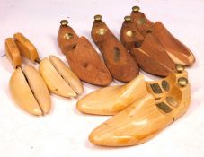 Four pairs of gentlemens wooden shoe trees, to include two from Harrods and another by Edward