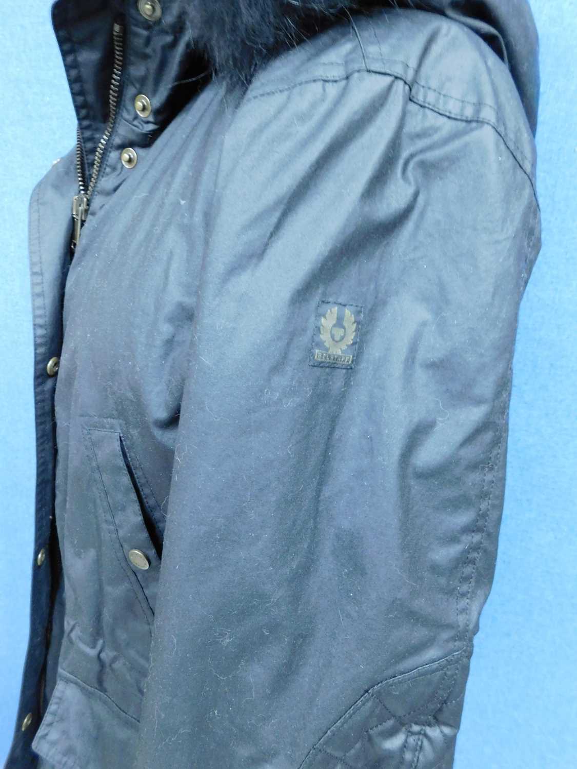 A lady's black Belstaff hooded parka, zip fronted with storm flap and popper fastening, front - Image 4 of 9