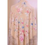 A late 19th / early 20th century silk floral embroidered fringed shawl, together with another