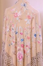 A late 19th / early 20th century silk floral embroidered fringed shawl, together with another