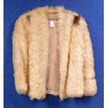 A lady's cream astrakhan fur jacket