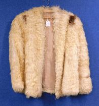 A lady's cream astrakhan fur jacket