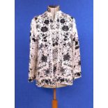 A white satin and black embroidered Chinese jacket by Plum Blossom, with high collar, long sleeves