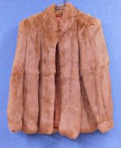 A lady's brown French rabbit fur jacket