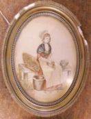 An early 20th century needlework picture of a seated maiden, with painted detail to face and arms,