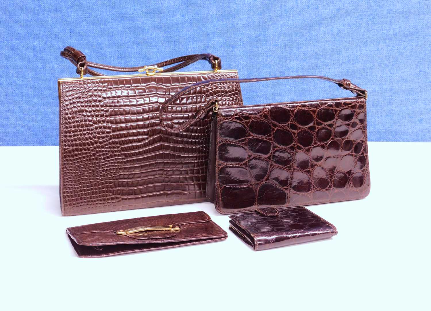 A small group of mid 20th Century lady's accessories to include two mock croc brown leather