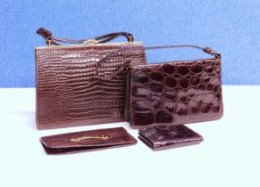 A small group of mid 20th Century lady's accessories to include two mock croc brown leather