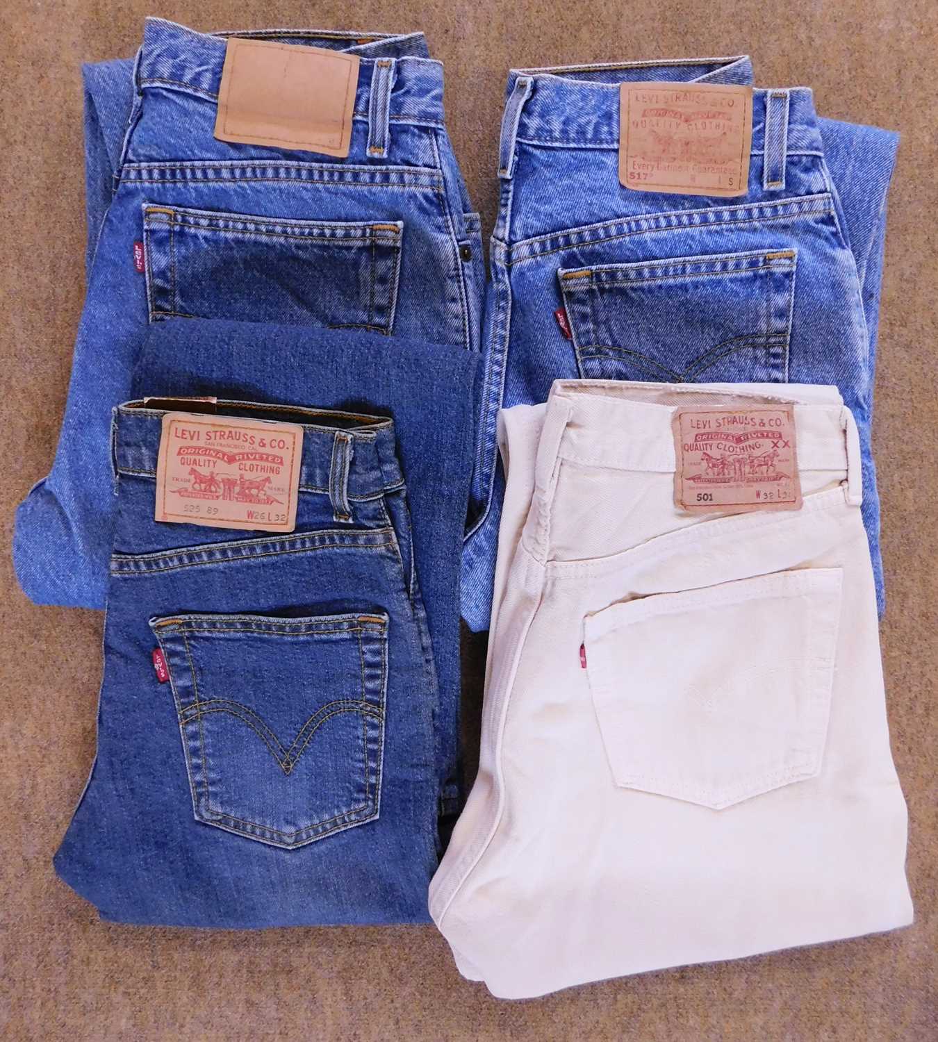 Four pairs of lady's Levi jeans, to include 550 realxed fit, 517 slim fit, 529 (W26 L32) unworn with