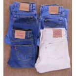 Four pairs of lady's Levi jeans, to include 550 realxed fit, 517 slim fit, 529 (W26 L32) unworn with