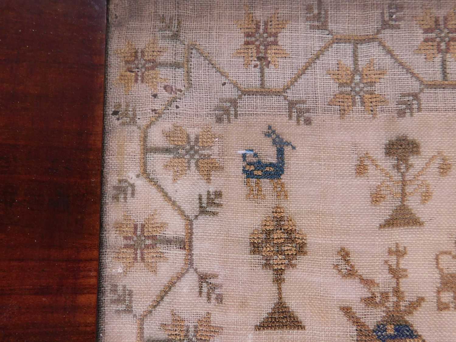 A mid 19th century needlwork sampler, with religious text, flora and fauna decoration, named 'Ann - Image 5 of 7