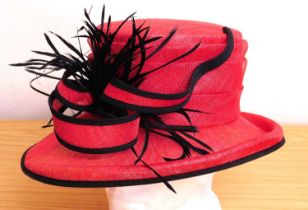 A Cappelli Condici straw hat in red with black trim and detail, new with tags