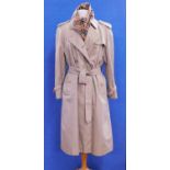 A lady's Burberry double breasted trenchcoat, size 16 Petite, together with a Burberry cashmere