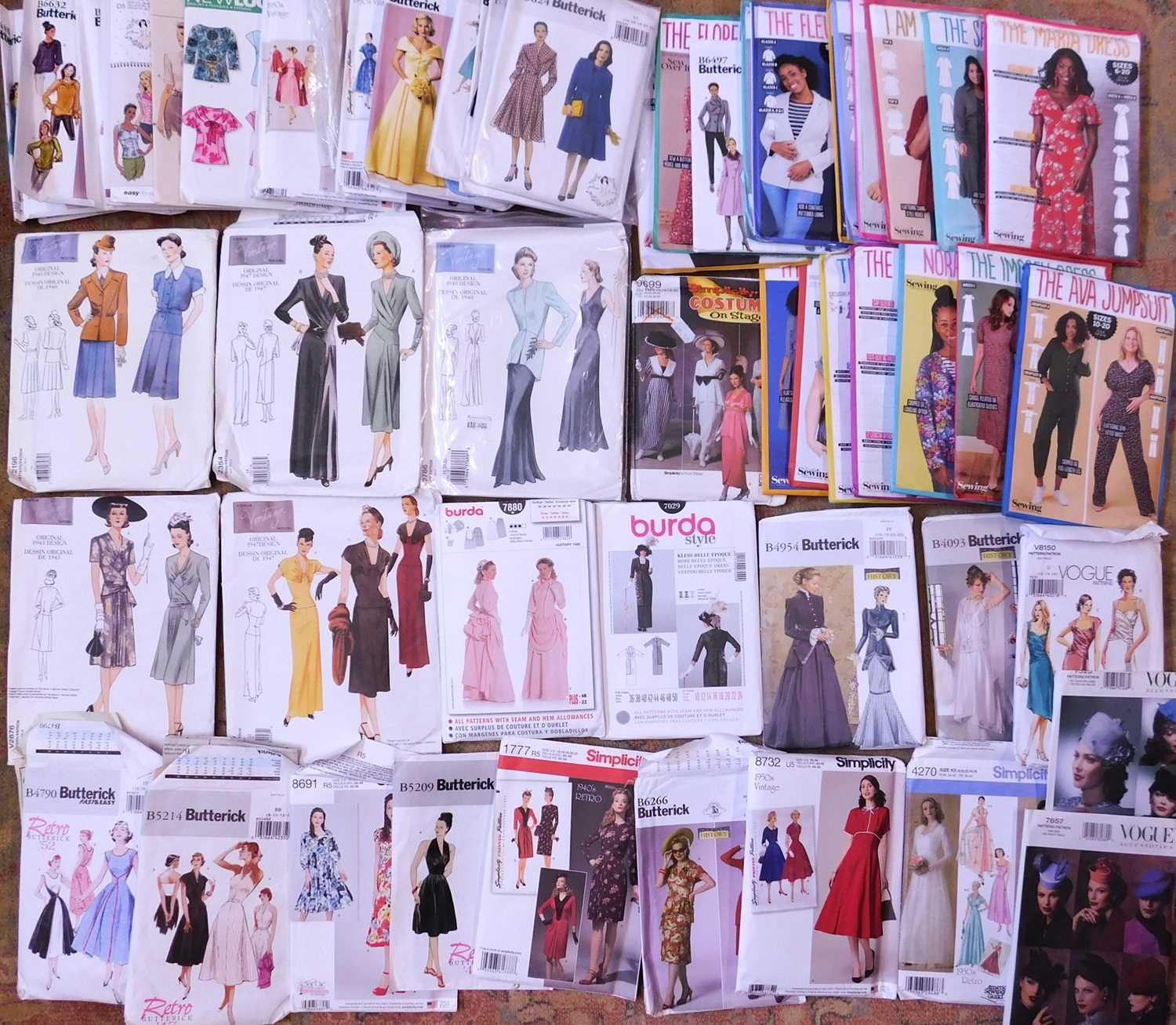 A quantity of sewing patterns to include vintage style dresses, Vogue patterns, and others, (qty)
