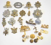 Quantity of British 20th century cap badges to include The border Regt, The royal Scots, RASC, royal