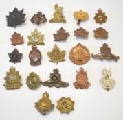 Quantity 22 Canadian cap badges to include: Canadian North West mounted police, Royal Canadian