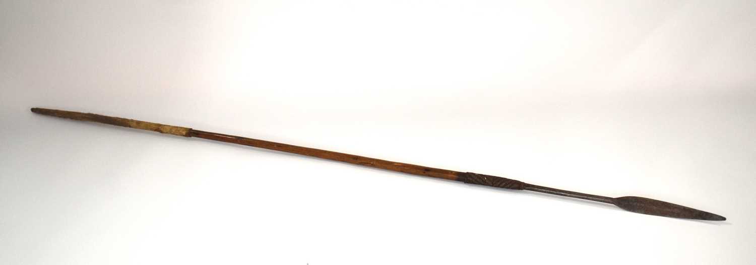 Aboriginal / tribal throwing spear with animal hide band on bottom of shaft. Metal wire hatching