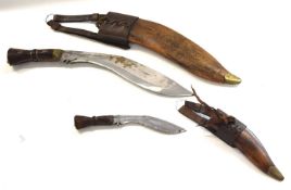 Two Reproduction British Army issue Kukri's stamped 1917 consisting of one large and one small, in