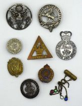 Quantity of military badges to include silver GRV king and empire service rendered badge
