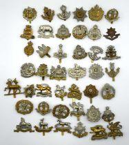 Quantity of 20th century British Infantry and Yeomanry cap badges to include Shropshire Yeomanry,