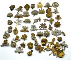 Quantity of 20th century cap badges to include cavalry and infantry badges to include: Lancashire