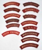 Quantity of thirteen Second World War printed cloth shoulder titles to include: Pair of