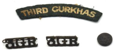 Second World War Third Gurkha Rifle insignia to include one cloth shoulder title, two 3GR metal