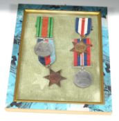 Framed set of Four Second World War British Campaign medals comprising of 1939-45 Star, France and