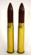 Two Victorian Wooden tipped inert blank artillery rounds with brass shell casings. casings and heads