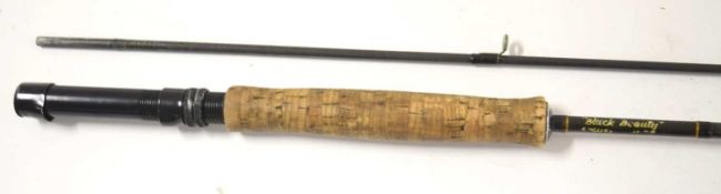 A Lamiglas 8’6” 2-part ‘black beauty’ fly rod in original cloth bag.