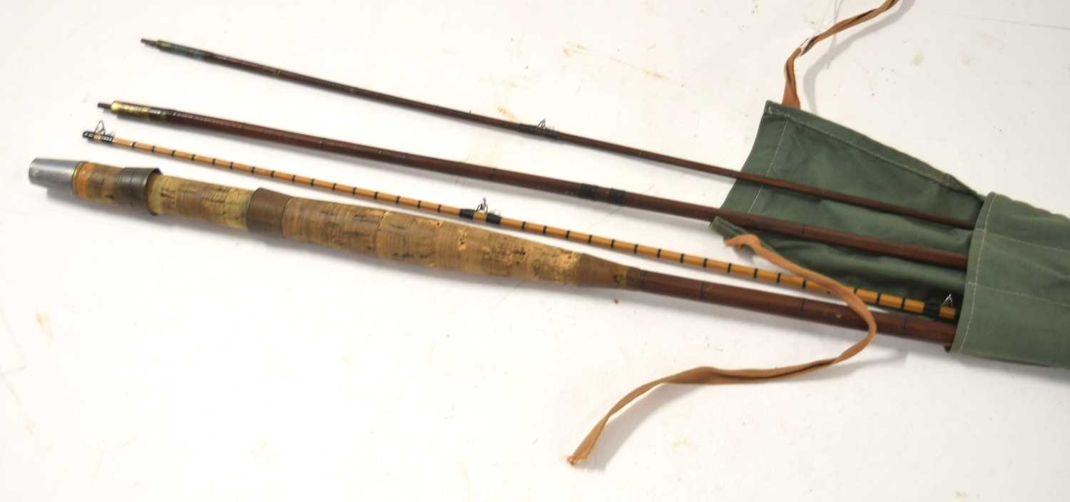 A 20th century 3 section cane fly fishing rod measuring approx. 320cm long tin olive green cloth bag