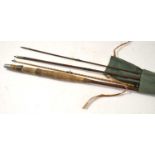 A 20th century 3 section cane fly fishing rod measuring approx. 320cm long tin olive green cloth bag