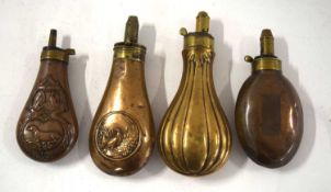 Quantity of 4 brass and copper 19th century hunting powder flasks to include flask with dogs and