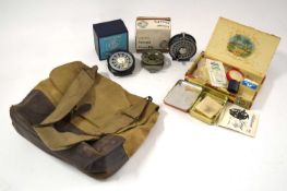 Quantity of 20th century fishing reels and tackle in canvas fishing bag to include: Vintage ‘The