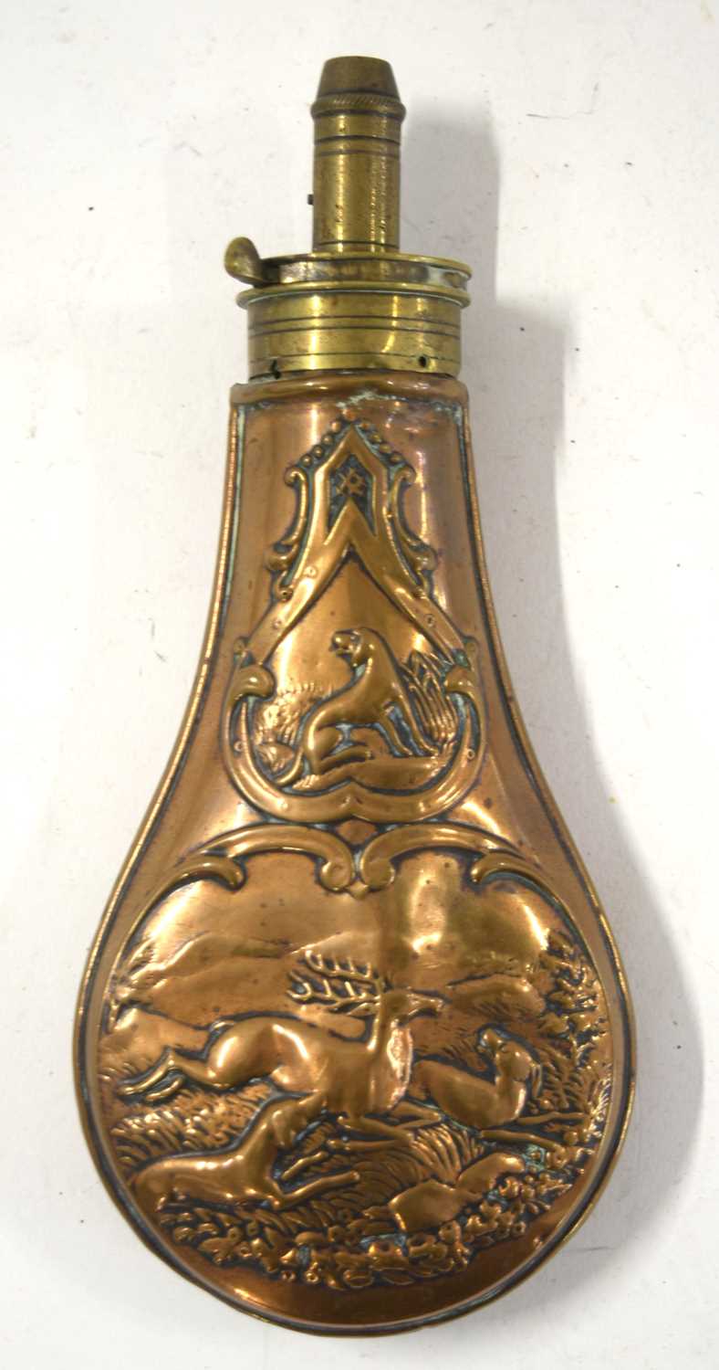 Three 19th century brass and copper powder flasks to include copper powder flask with dogs and a - Image 4 of 10