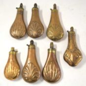 6x 19th century copper powder flasks (a/f) with fluted and shell patterns together with further