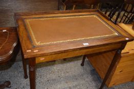 An Edwardian oak writing table with leather inset, 87cm wide (Item 130 on vendor list)