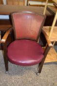 An early 20th Century oak framed leather armchair (Item 104 on vendor list)